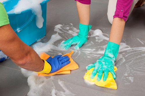 Carpet cleaning team following safe working practices during a cleaning job
